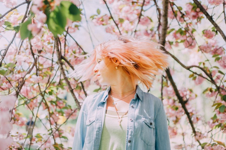 Summer Shealy's pink hair in the Cherry Blossoms at Central Park in NYC New York City