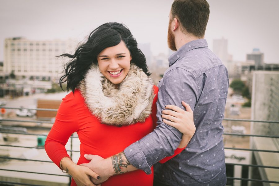 Jaymes and Jordan Downer maternity photoshoot in downtown fort worth red dress with fur scarf