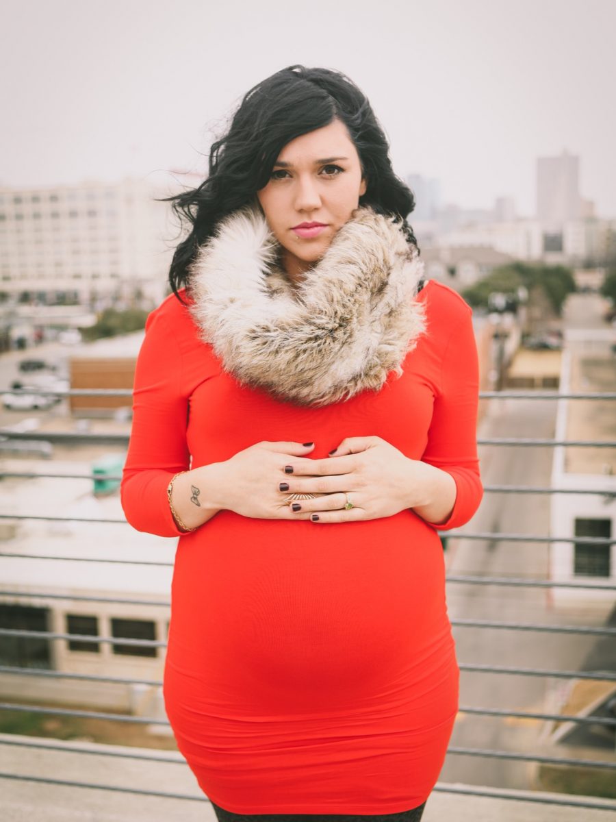 Jordan Downer maternity photoshoot in downtown fort worth red dress with fur scarf