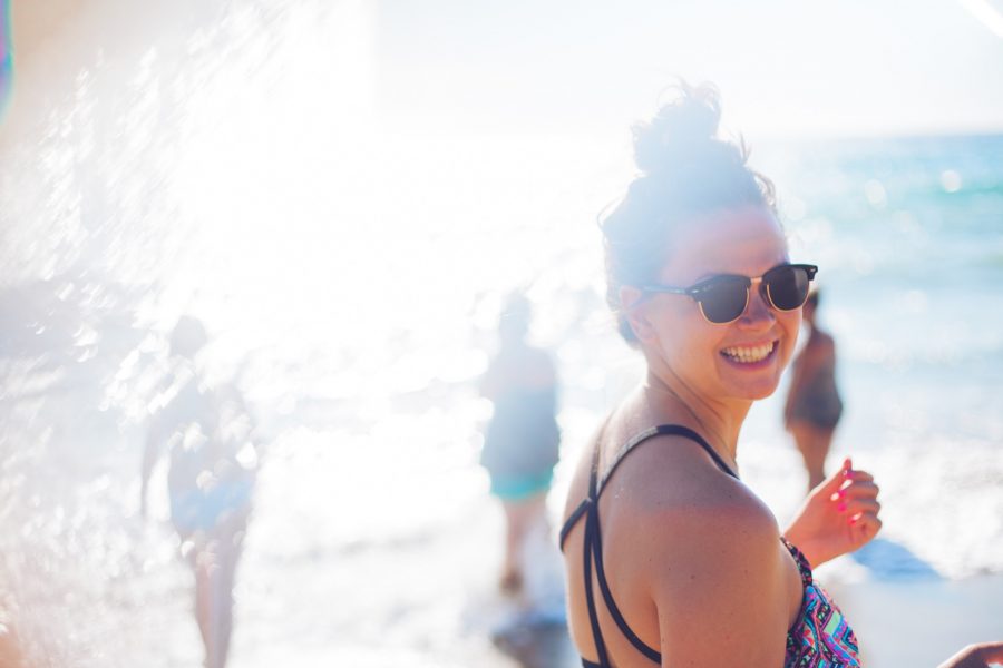 Tara Spivey in Malibu, CA beach with ray ban sun glasses